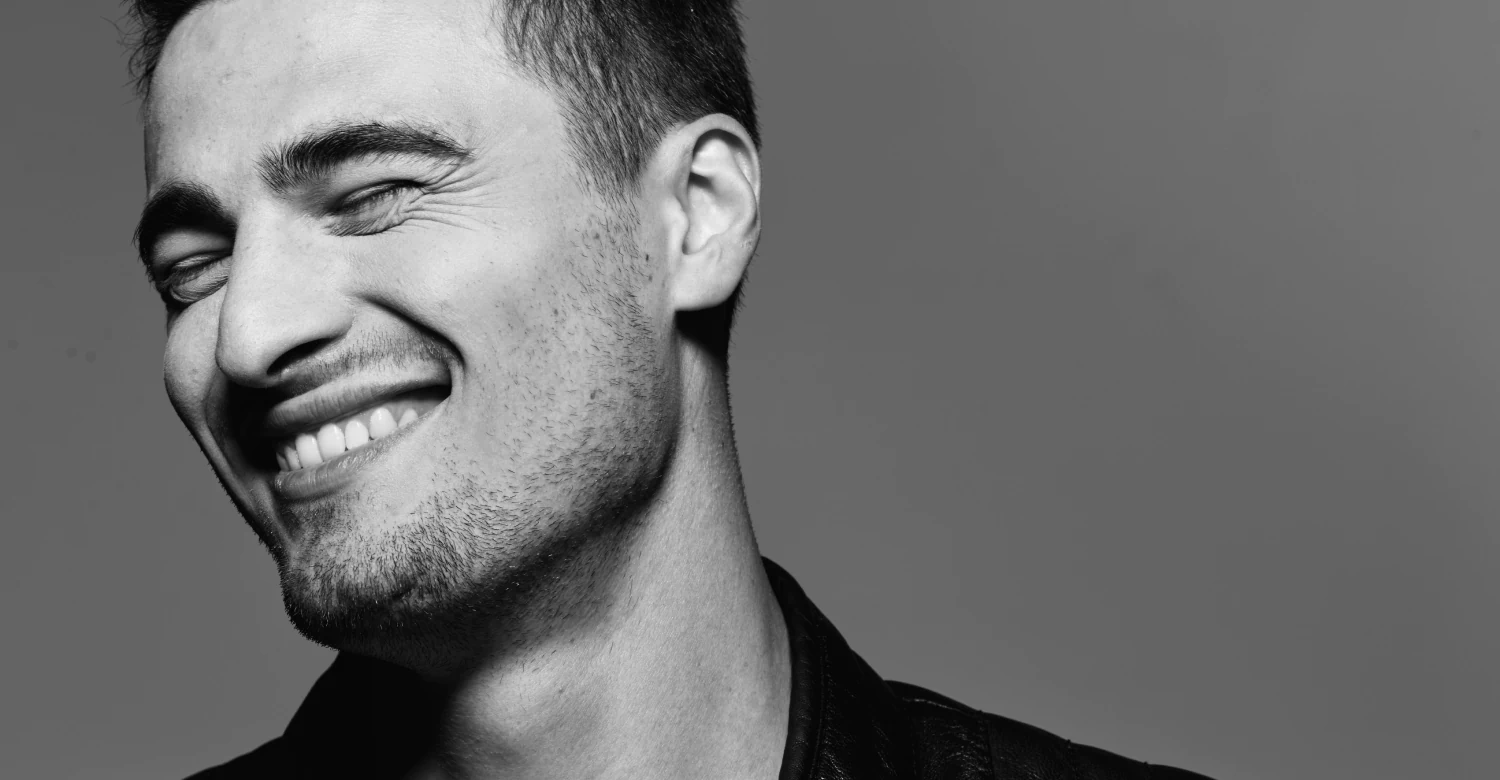 A man with a perfect smile at Vivere Meliora Dentistry